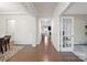 Bright entryway showcasing hardwood floors, neutral paint, and elegant trim work at 19412 Bird Meadow Dr, Huntersville, NC 28078
