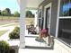 Charming front porch featuring comfortable seating, flowers, and classic architectural details at 19412 Bird Meadow Dr, Huntersville, NC 28078