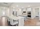 Modern kitchen featuring stainless steel appliances, gray cabinets, and a large center island at 19412 Bird Meadow Dr, Huntersville, NC 28078