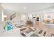 Open-concept living space with hardwood floors, modern kitchen, and comfortable seating at 19412 Bird Meadow Dr, Huntersville, NC 28078