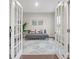 Comfortable living room with french doors and calming gray color scheme at 19412 Bird Meadow Dr, Huntersville, NC 28078