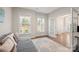Sunlit living room featuring neutral walls, hardwood floors, and a cozy seating area at 19412 Bird Meadow Dr, Huntersville, NC 28078