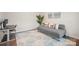 Comfortable living room with french doors and calming gray color scheme at 19412 Bird Meadow Dr, Huntersville, NC 28078