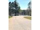 Picturesque view of a quiet community road leading to a serene lake at 201 Fancy Lady Ct, York, SC 29745