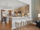 Open-concept kitchen featuring stainless steel appliances, a breakfast bar with seating, and a view to the dining area at 2018 Puddle Pond Rd, Indian Trail, NC 28079