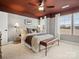 Beautifully staged main bedroom with neutral tones, ceiling fan, and natural light at 2018 Puddle Pond Rd, Indian Trail, NC 28079