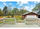 Backyard with a garage and a wooden fence, as seen from the deck at 2208 Bay St, Charlotte, NC 28205