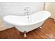 Elegant clawfoot tub with chrome fixtures and a tiled wall at 2208 Bay St, Charlotte, NC 28205