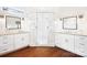 Bathroom featuring a double vanity with granite counters and a glass shower at 2208 Bay St, Charlotte, NC 28205