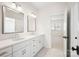 Bathroom featuring a double vanity, shaker cabinets, chrome fixtures, and sleek design at 2208 Bay St, Charlotte, NC 28205