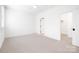 Spacious bedroom featuring clean, neutral walls and carpet, perfect for relaxation and personalization at 2208 Bay St, Charlotte, NC 28205