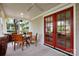 Inviting covered porch with a dining area and access to the home through double doors at 2208 Bay St, Charlotte, NC 28205