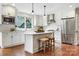 Bright kitchen featuring white cabinets, stainless steel appliances, and a center island at 2208 Bay St, Charlotte, NC 28205