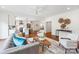 Open-concept living room showcasing the kitchen, hardwood floors, and neutral decor at 2208 Bay St, Charlotte, NC 28205
