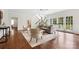Cozy living room featuring a neutral color palette, area rug, and a staircase in the background at 2208 Bay St, Charlotte, NC 28205