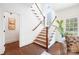 Bright foyer features a staircase with wooden treads and white risers and banister under a skylight at 2208 Bay St, Charlotte, NC 28205