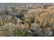 Bird's-eye view of the property highlighting the home's setting among mature trees and neighborhood at 2706 Booker St, Gastonia, NC 28054