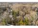 Aerial view shows a property's landscape, blending wooded areas with residential settings at 2706 Booker St, Gastonia, NC 28054