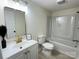 Bathroom featuring modern fixtures, vanity, and a bathtub with shower at 2706 Booker St, Gastonia, NC 28054