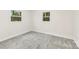 Bedroom with new carpet, neutral paint, and two windows at 2706 Booker St, Gastonia, NC 28054