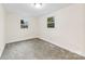 Bright bedroom with new carpet, neutral paint, ceiling light, and one window at 2706 Booker St, Gastonia, NC 28054
