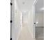 Hallway view with hardwood floors and doors to bedrooms and other rooms at 2706 Booker St, Gastonia, NC 28054