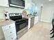 Close-up of the kitchen with stainless steel appliances, and white cabinetry at 2706 Booker St, Gastonia, NC 28054