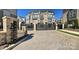 Gated community entrance with brick pillars and an automated gate, offering enhanced security and privacy at 2916 Grand Union Way, Charlotte, NC 28209