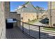 View from a deck of brick townhomes with gray siding at 2916 Grand Union Way, Charlotte, NC 28209