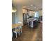 Spacious kitchen featuring a large island with seating, stainless steel appliances, and hardwood floors at 2916 Grand Union Way, Charlotte, NC 28209