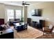 Bright living room with large windows, hardwood floors, a ceiling fan and stylish decor at 2916 Grand Union Way, Charlotte, NC 28209