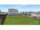 Large, lush backyard with black fencing, and well-maintained lawn at 3013 Whipcord Dr, Waxhaw, NC 28173