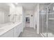Spacious bathroom with double sinks, elegant tile, and a walk-in shower at 3013 Whipcord Dr, Waxhaw, NC 28173