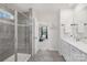 Bright bathroom featuring modern fixtures, a walk-in shower, and neutral tones at 3013 Whipcord Dr, Waxhaw, NC 28173
