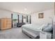 Cozy bedroom with a futon, dresser, and a comfortable bed in a well-lit space at 3013 Whipcord Dr, Waxhaw, NC 28173