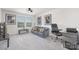 Comfortable living room with a sofa, desk, and large windows providing natural light at 3013 Whipcord Dr, Waxhaw, NC 28173
