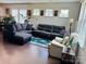 Bright living room features hardwood floors, stylish furniture, and decorative accents at 3013 Whipcord Dr, Waxhaw, NC 28173
