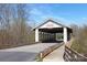 Rustic covered bridge entrance to Millbridge community at 3013 Whipcord Dr, Waxhaw, NC 28173