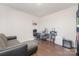 This home office features a comfortable gray sofa, desk, and gray rolling office chair at 3013 Whipcord Dr, Waxhaw, NC 28173