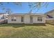 Neat backyard featuring a well-maintained lawn and light-colored siding, exuding charm and tranquility at 3023 Fairglen Rd, Charlotte, NC 28269