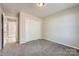 Bedroom features neutral carpet and a closet at 3023 Fairglen Rd, Charlotte, NC 28269