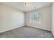 Bedroom features neutral carpet and a window at 3023 Fairglen Rd, Charlotte, NC 28269