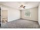 Bedroom features neutral carpet, a window and ceiling fan at 3023 Fairglen Rd, Charlotte, NC 28269