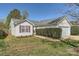 Well-maintained home with green grass and a manicured hedge at 3023 Fairglen Rd, Charlotte, NC 28269