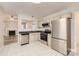 Modern kitchen features stainless steel appliances, tile backsplash, and white cabinets at 3023 Fairglen Rd, Charlotte, NC 28269