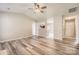Open living space showcasing wood-look flooring, natural light, and open layout at 3023 Fairglen Rd, Charlotte, NC 28269