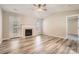 Bright living room with fireplace, laminate flooring and access to the backyard at 3023 Fairglen Rd, Charlotte, NC 28269