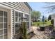 Private patio with outdoor seating, mature trees, and well maintained lawn at 3048 Misty Harbor Cir # E, Cramerton, NC 28032
