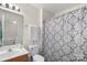 Clean bathroom with vanity, decorative mirror, and combined shower and bathtub at 3048 Misty Harbor Cir # E, Cramerton, NC 28032