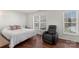 Bright bedroom featuring a queen bed, recliner, and plenty of natural light at 3048 Misty Harbor Cir # E, Cramerton, NC 28032